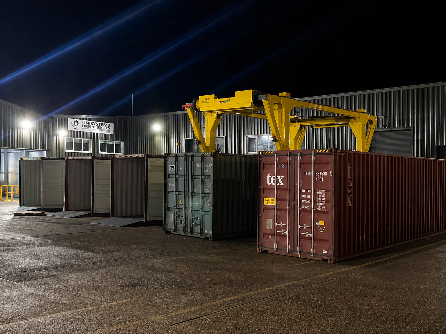 Container yard operations at night at the Unisystems Freight site